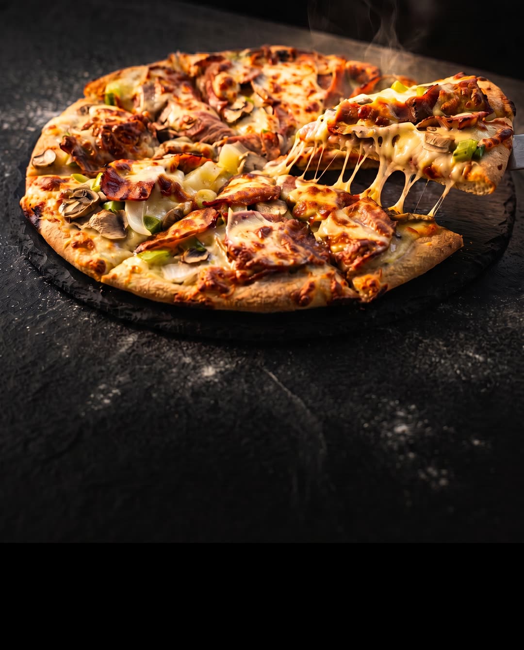 A Pizza Bros Steak Lovers pizza with a slice lifting away